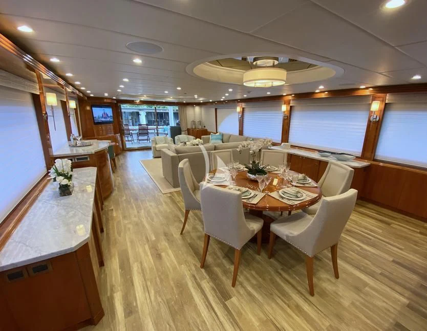 a large dining room with a table and chairs aboard BRANDI WINE Yacht for Charter