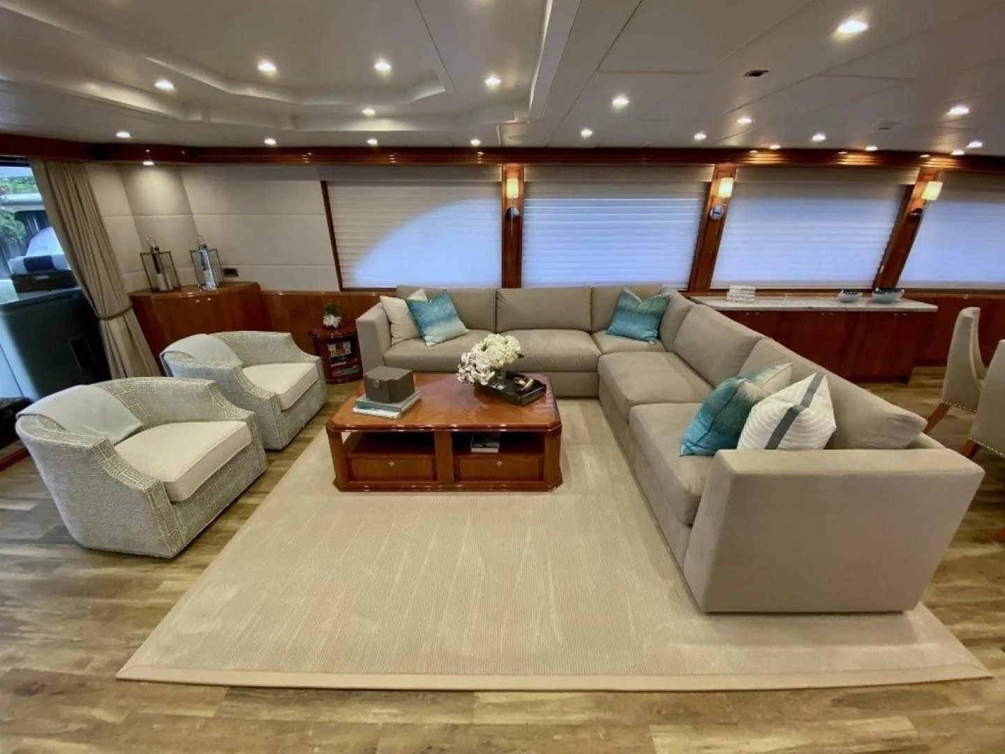 a large living room with a large window aboard BRANDI WINE Yacht for Charter