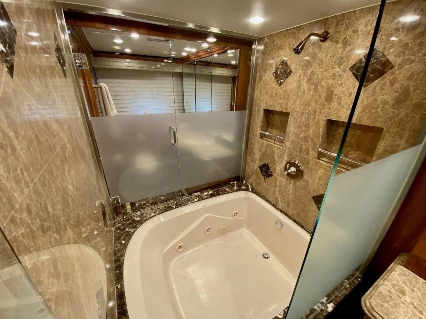 a bathroom with a bathtub and a shower aboard BRANDI WINE Yacht for Charter