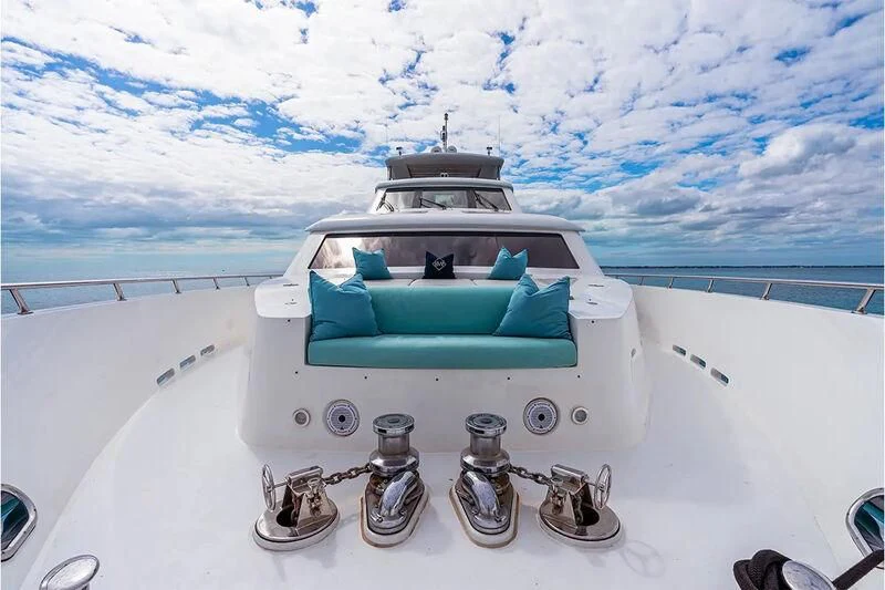 a white car with a green roof aboard BRANDI WINE Yacht for Charter