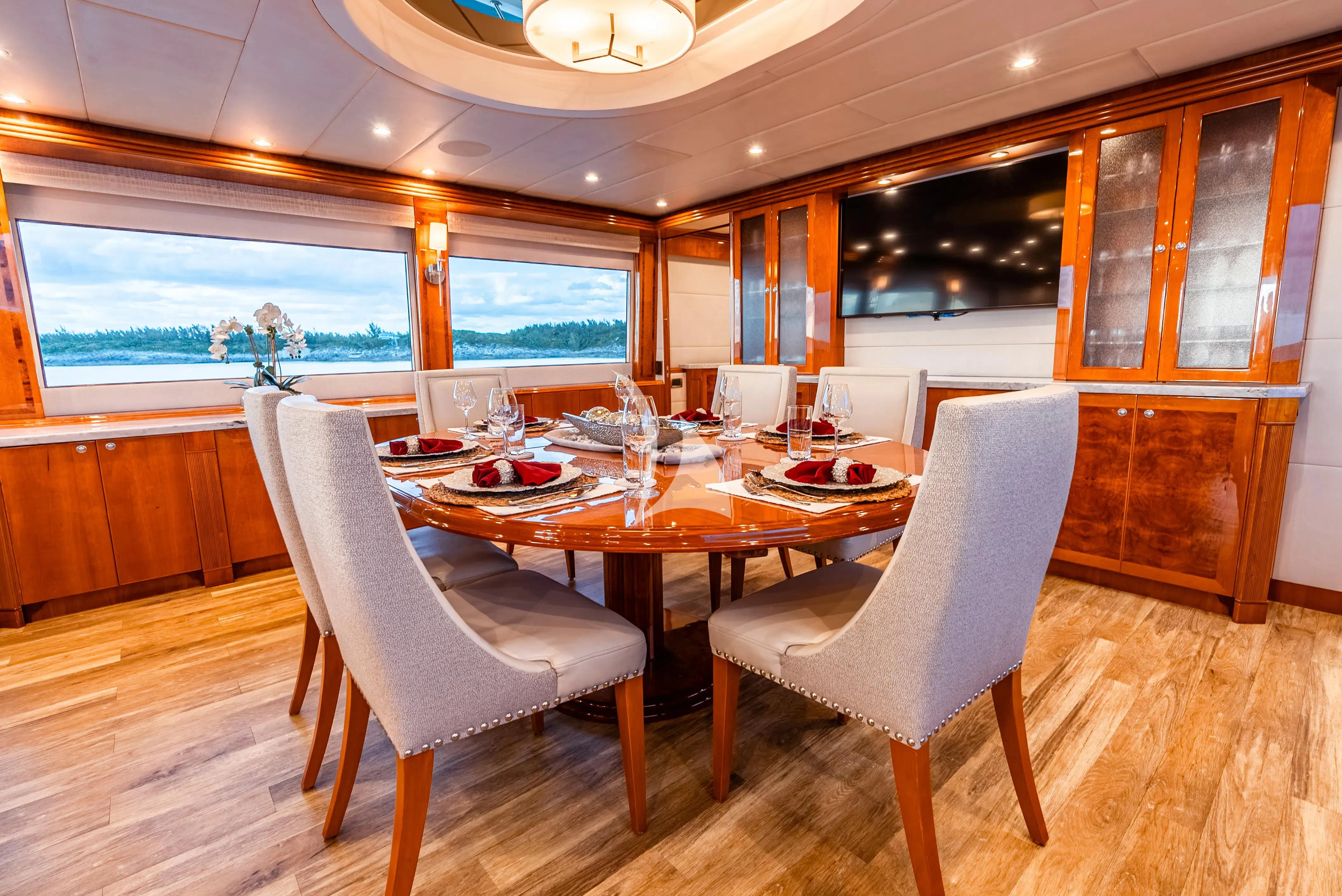 a dining room with a table aboard BRANDI WINE Yacht for Charter