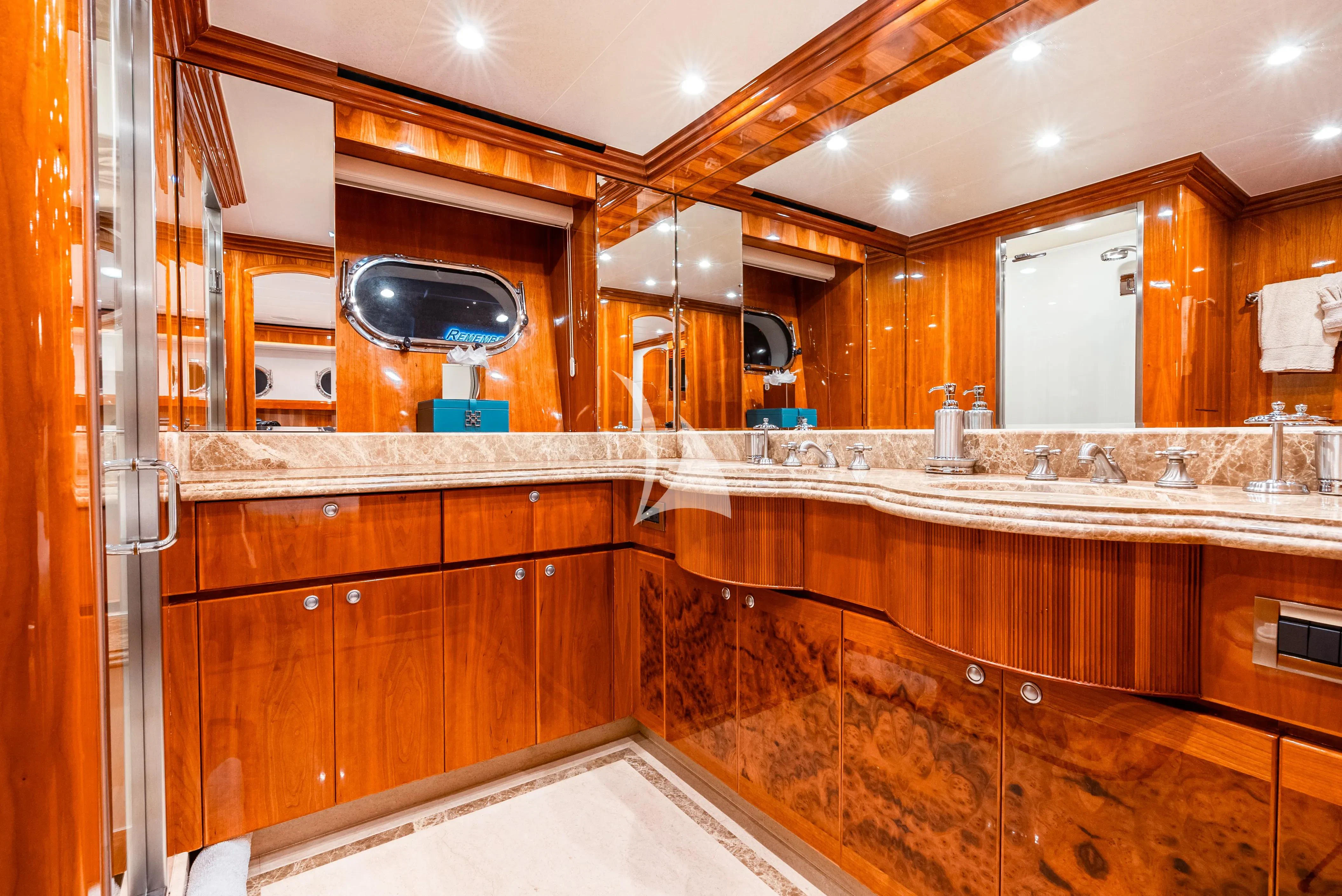 a kitchen with wooden cabinets aboard BRANDI WINE Yacht for Charter