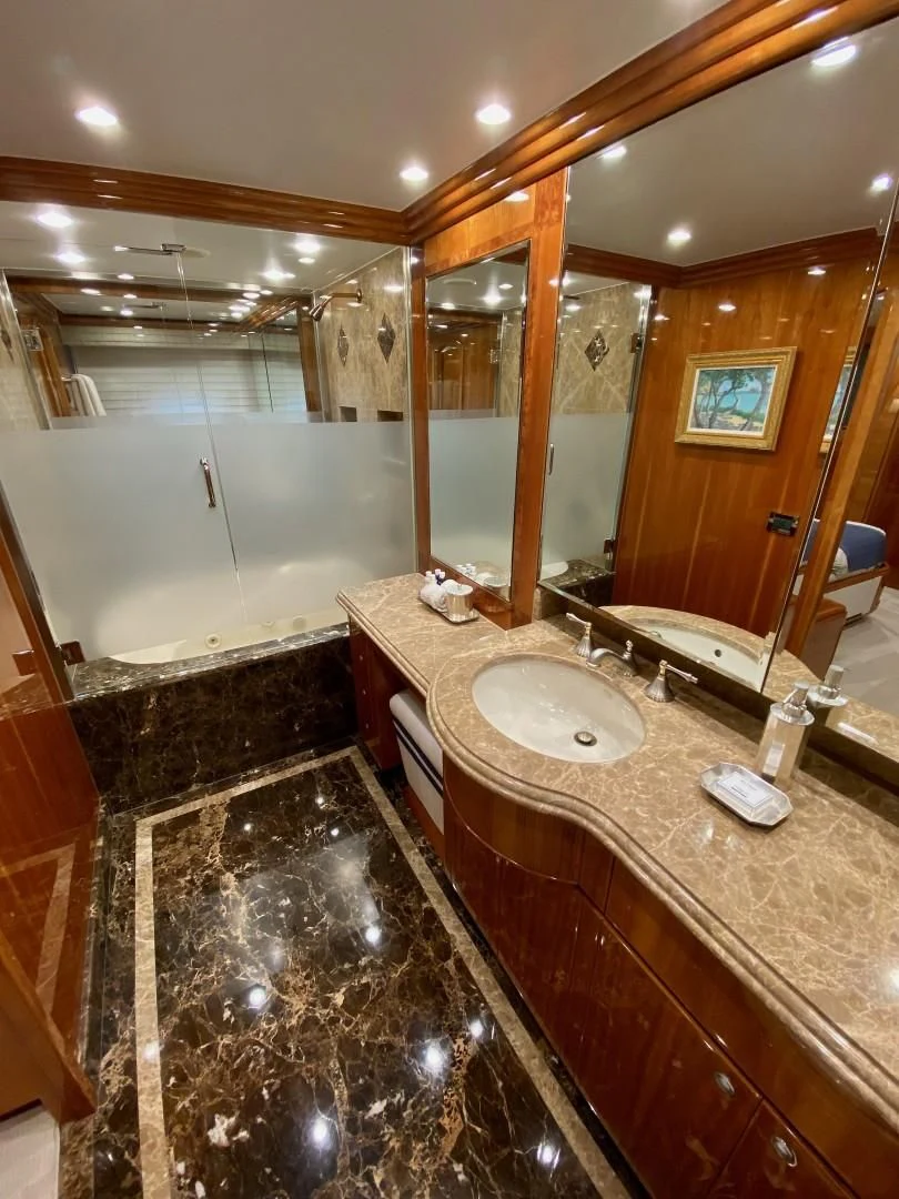 a bathroom with a large mirror aboard BRANDI WINE Yacht for Charter