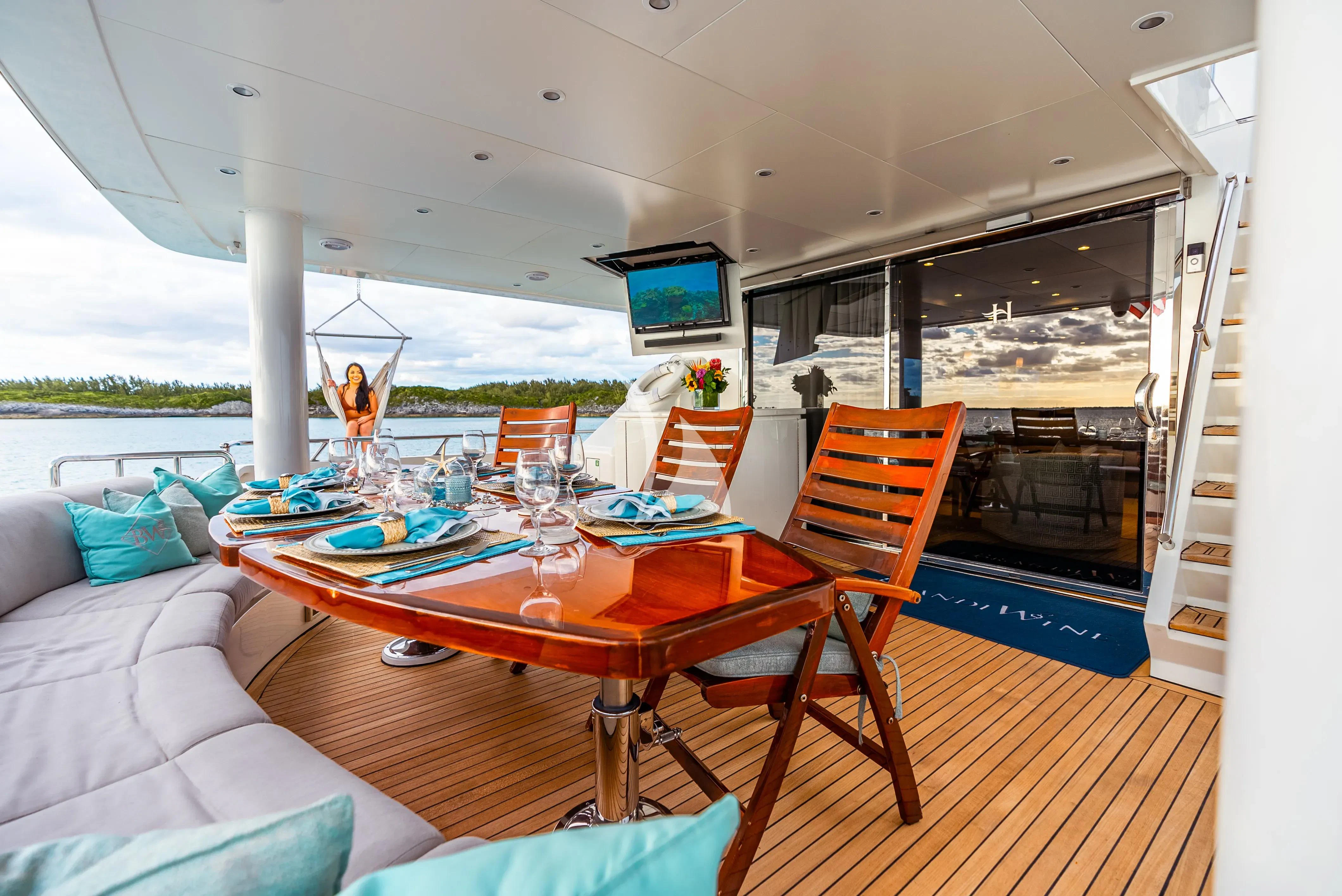 a dining table on a deck aboard BRANDI WINE Yacht for Charter