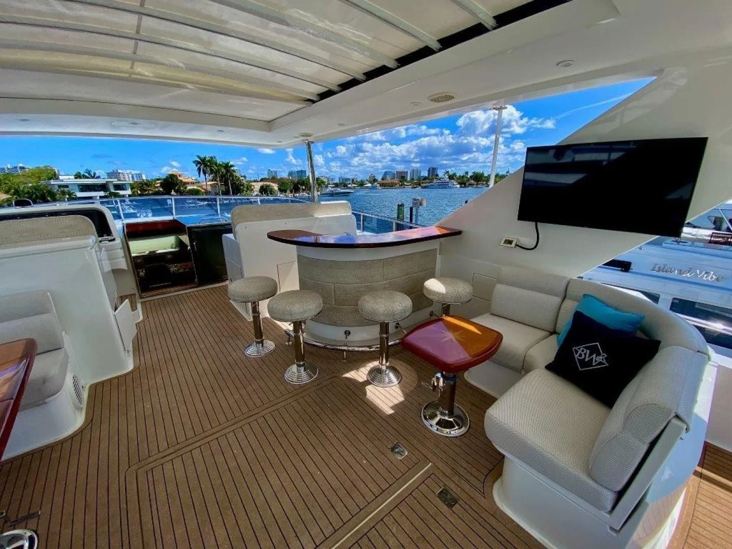 a room with a table chairs and a large window aboard BRANDI WINE Yacht for Charter