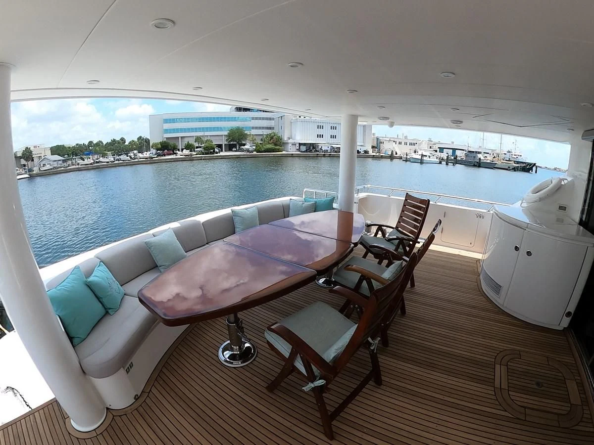 a room with a couch and a table and chairs aboard BRANDI WINE Yacht for Charter