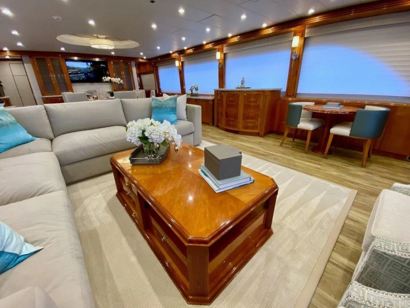 a living room with a table and chairs aboard BRANDI WINE Yacht for Charter
