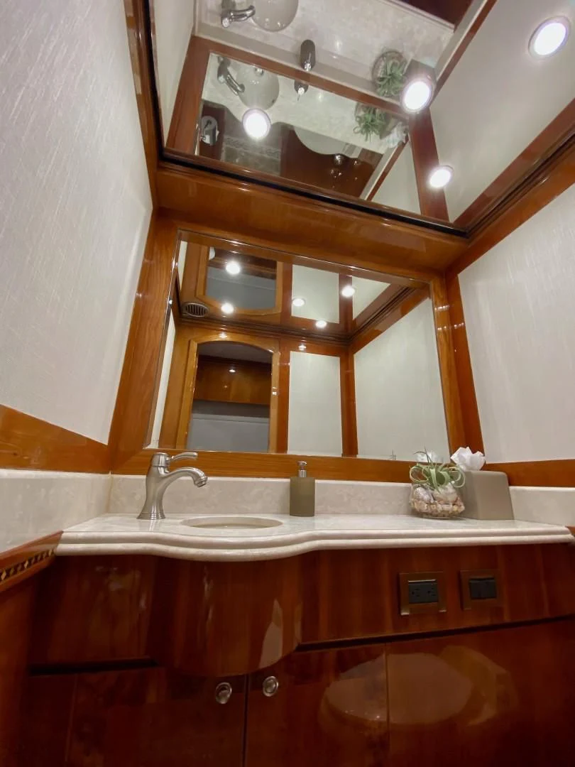 a bathroom with a large mirror aboard BRANDI WINE Yacht for Charter