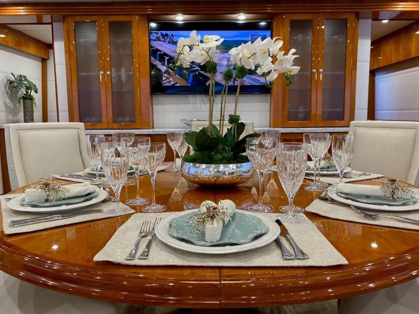 a table set with plates and glasses aboard BRANDI WINE Yacht for Charter