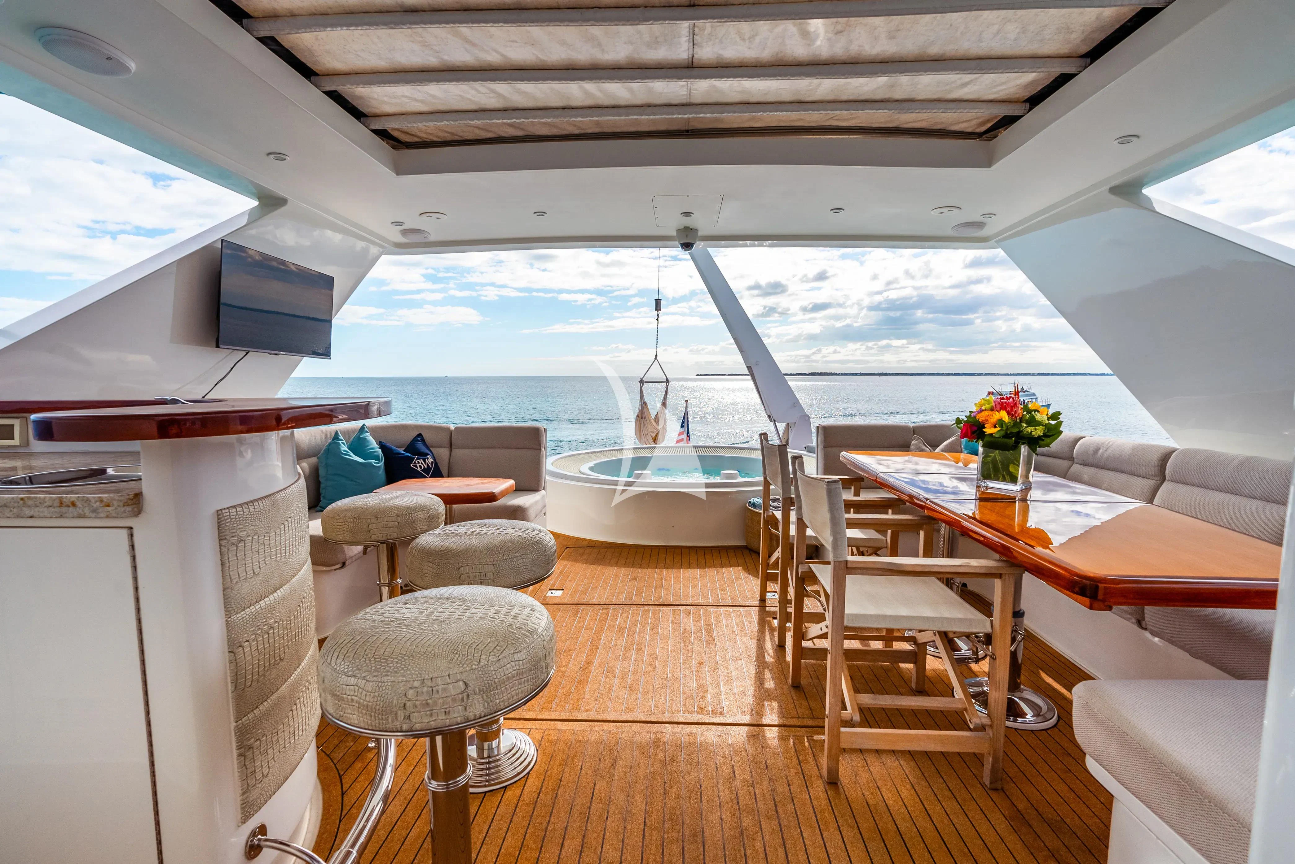 a room with a table and chairs aboard BRANDI WINE Yacht for Charter