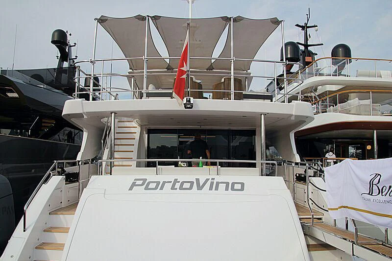 a boat with a flag on the front aboard PORTOVINO Yacht for Sale