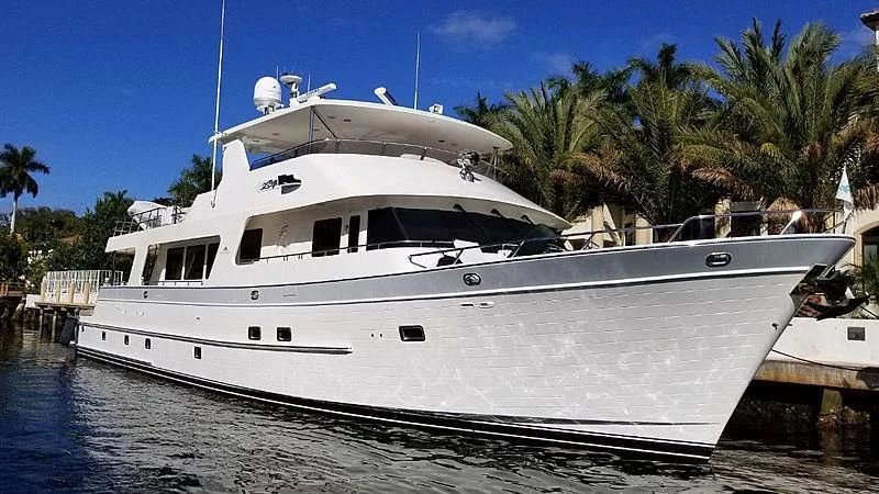 a white boat docked at a pier aboard 44 NORTH Yacht for Sale