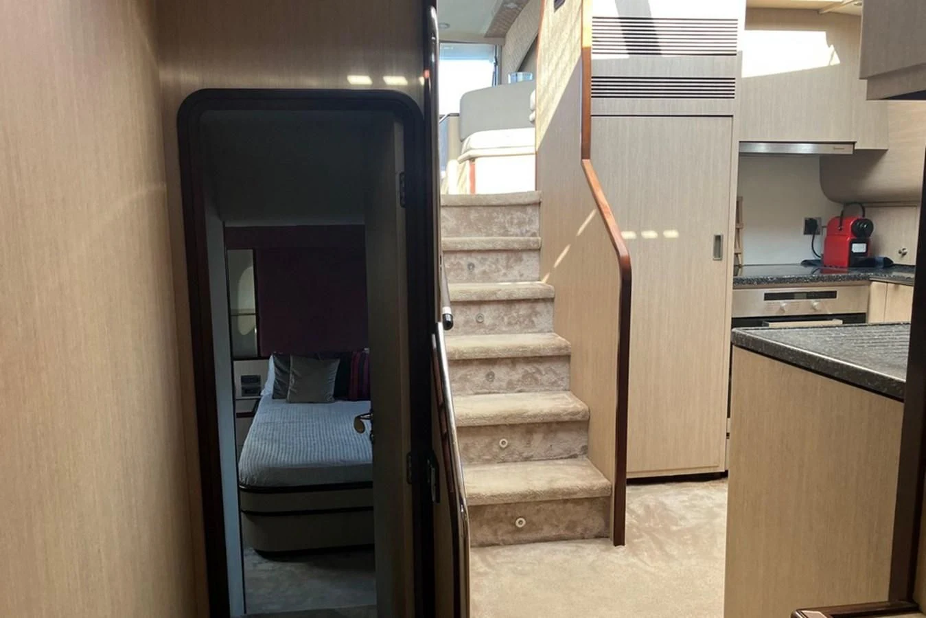 a staircase in a kitchen aboard VINTAGE Yacht for Sale