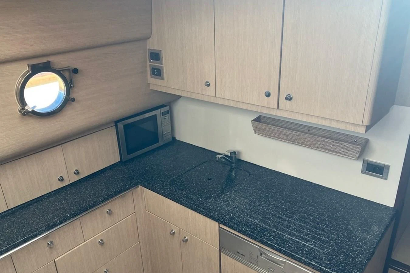 a kitchen with a marble counter top aboard VINTAGE Yacht for Sale