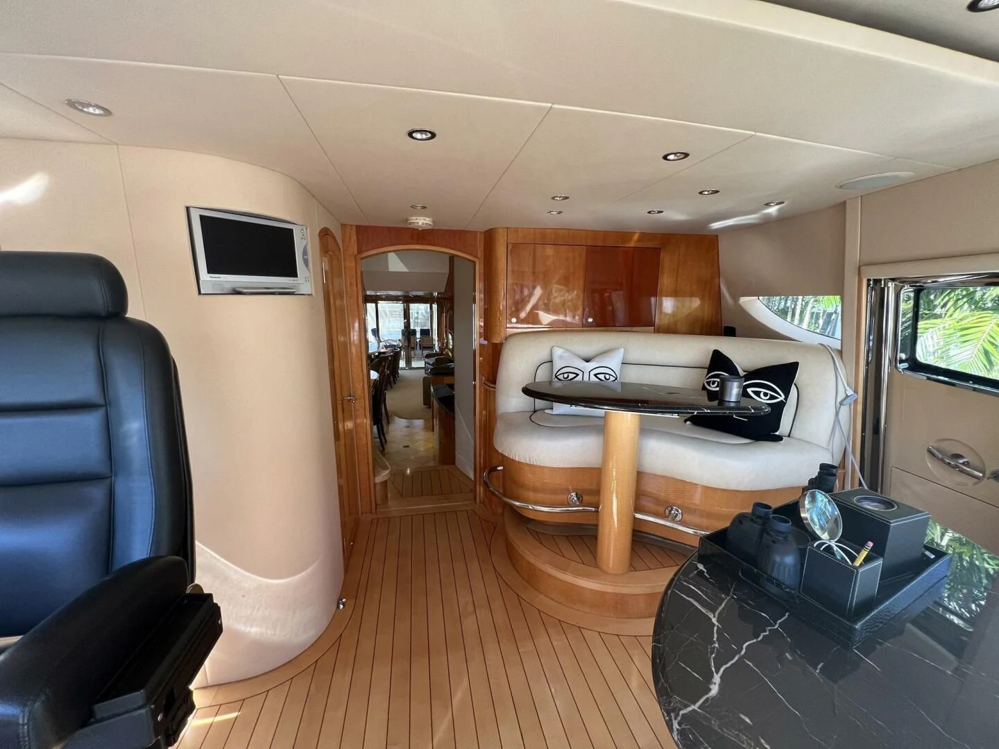 a bedroom with a bed and a television on the wall aboard ARETECTE Yacht for Sale