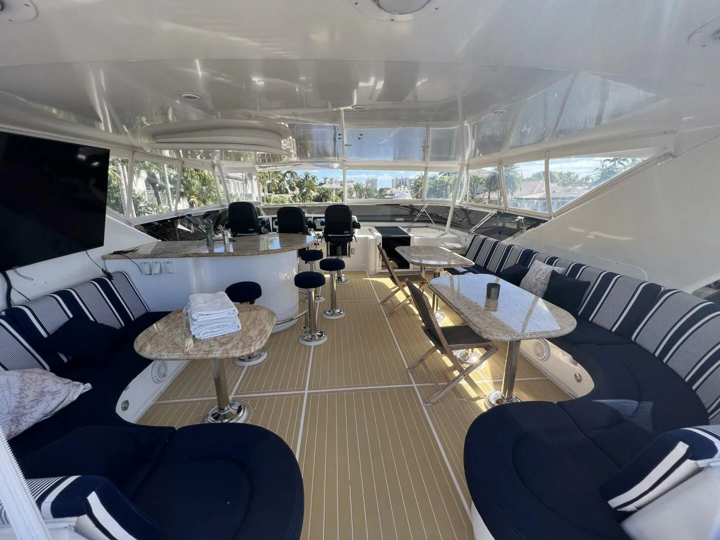 inside of a building with tables and chairs aboard ARETECTE Yacht for Sale