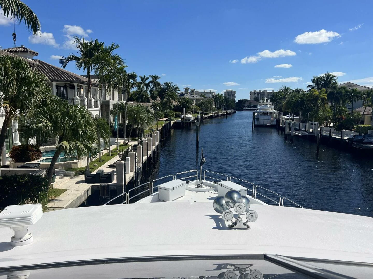 a pool with a fountain and buildings around it aboard ARETECTE Yacht for Sale