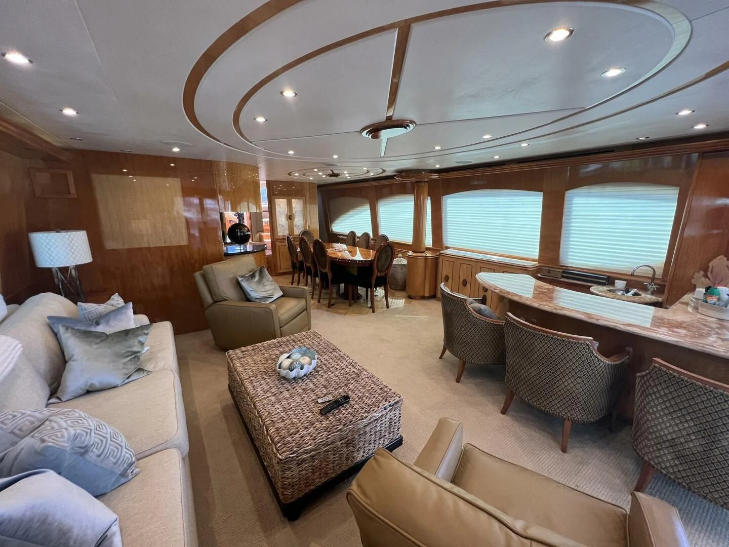 a living room with a large table and chairs aboard ARETECTE Yacht for Sale