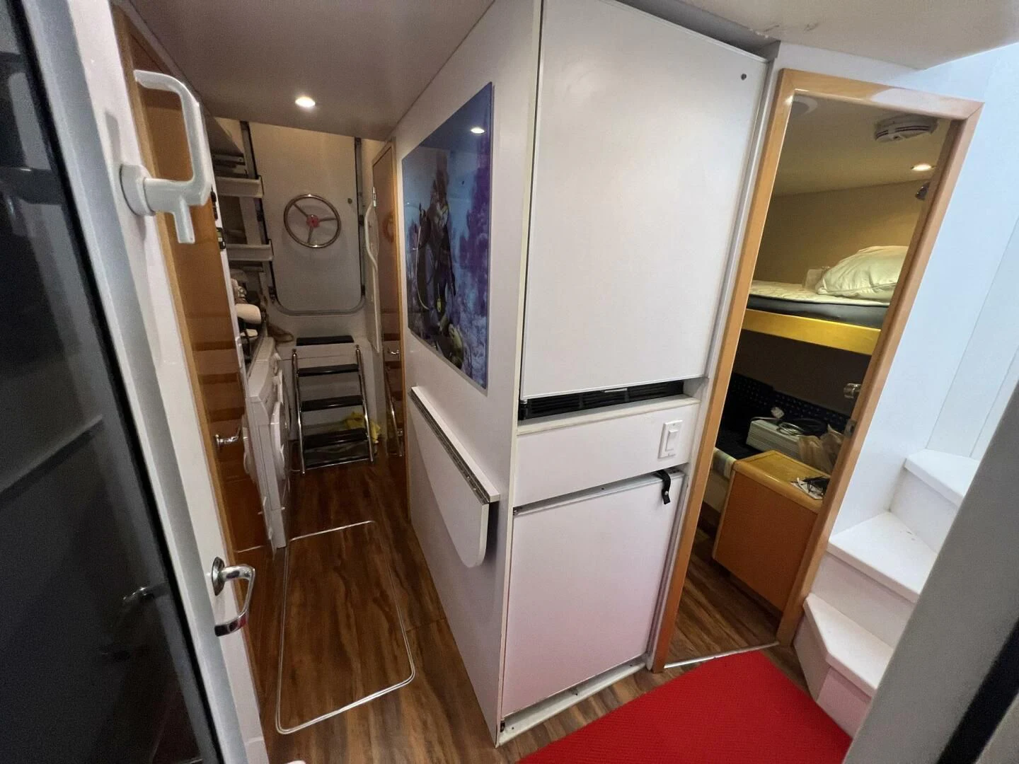 a hallway with a large mirror aboard ARETECTE Yacht for Sale