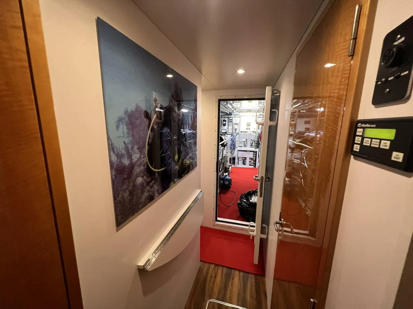 a hallway with a glass door aboard ARETECTE Yacht for Sale