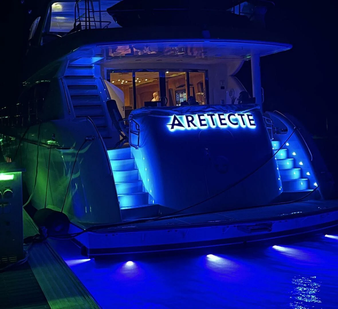 a blue and white sign on a stage aboard ARETECTE Yacht for Sale