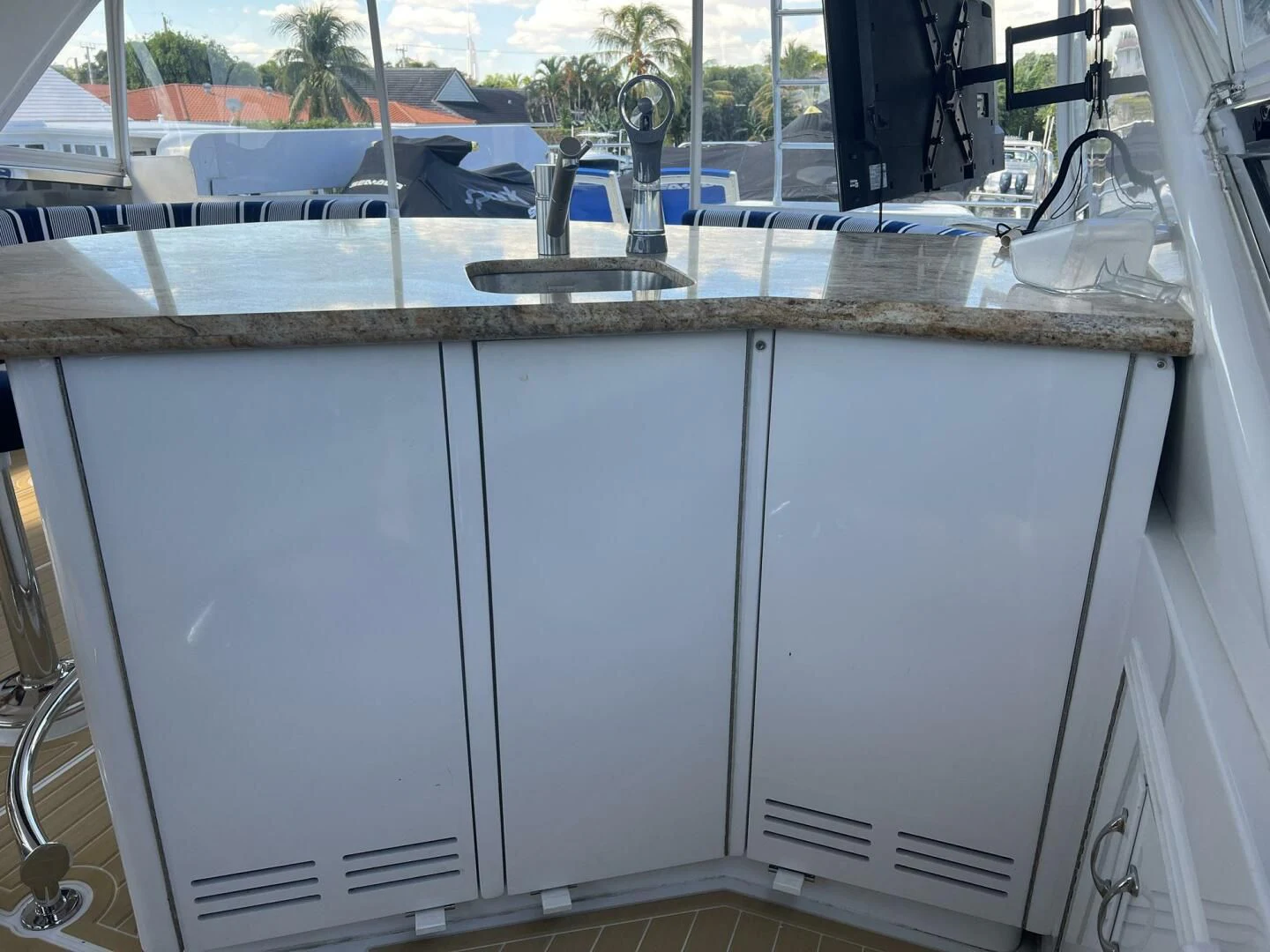 a kitchen with white cabinets aboard ARETECTE Yacht for Sale