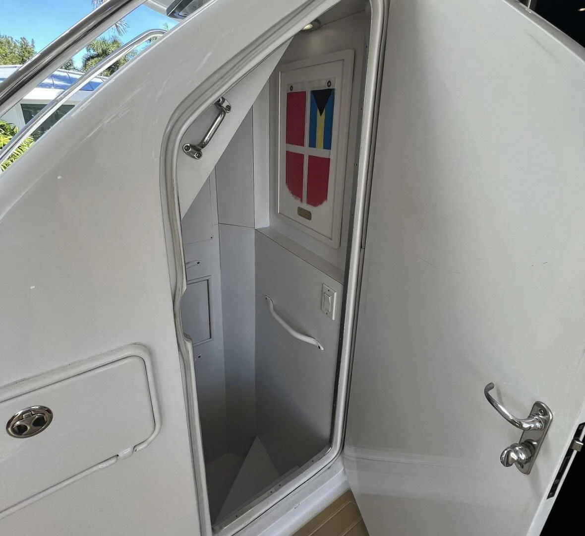 a white vehicle with a red stripe aboard ARETECTE Yacht for Sale