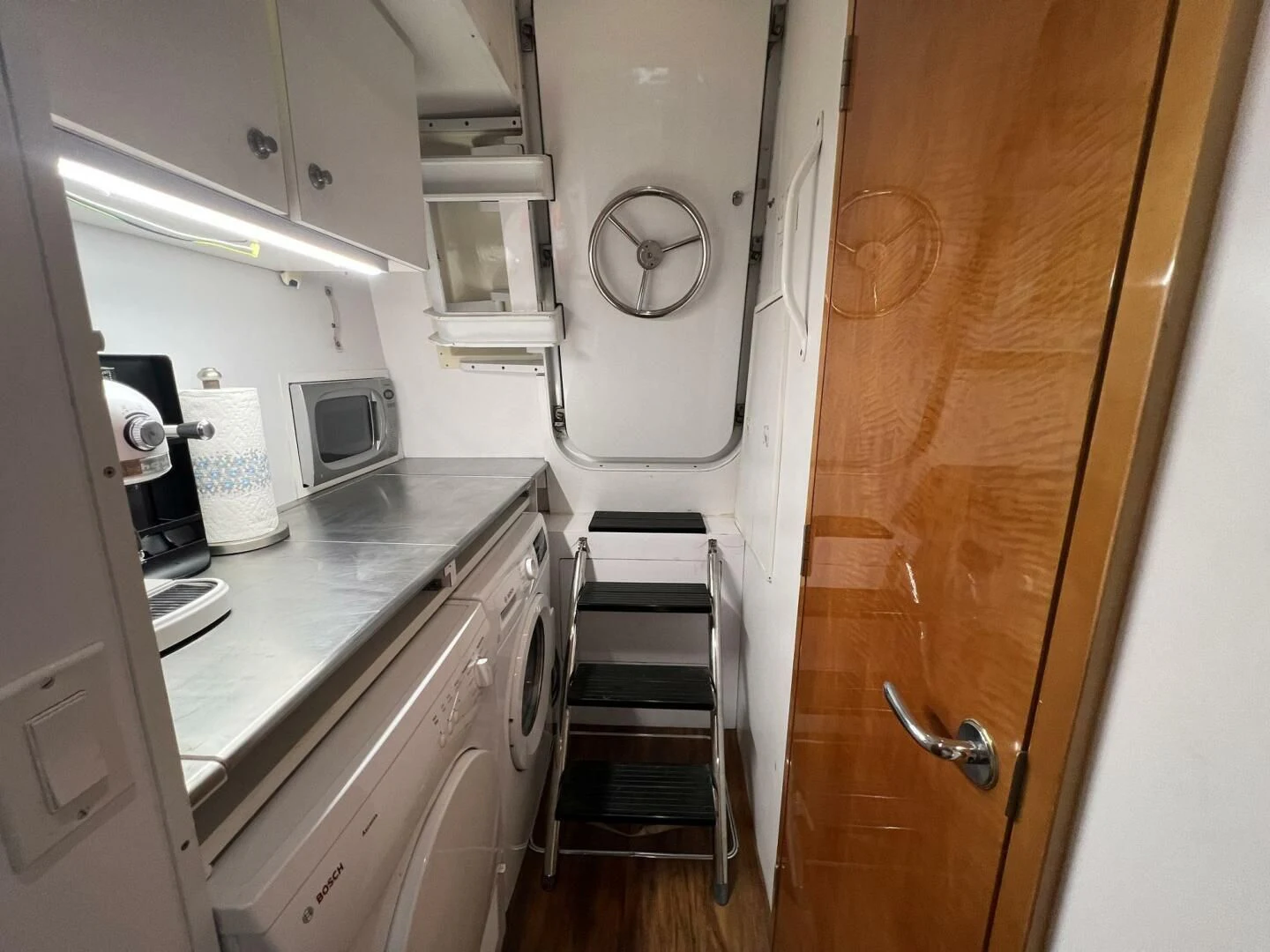 a small kitchen with a small vent aboard ARETECTE Yacht for Sale