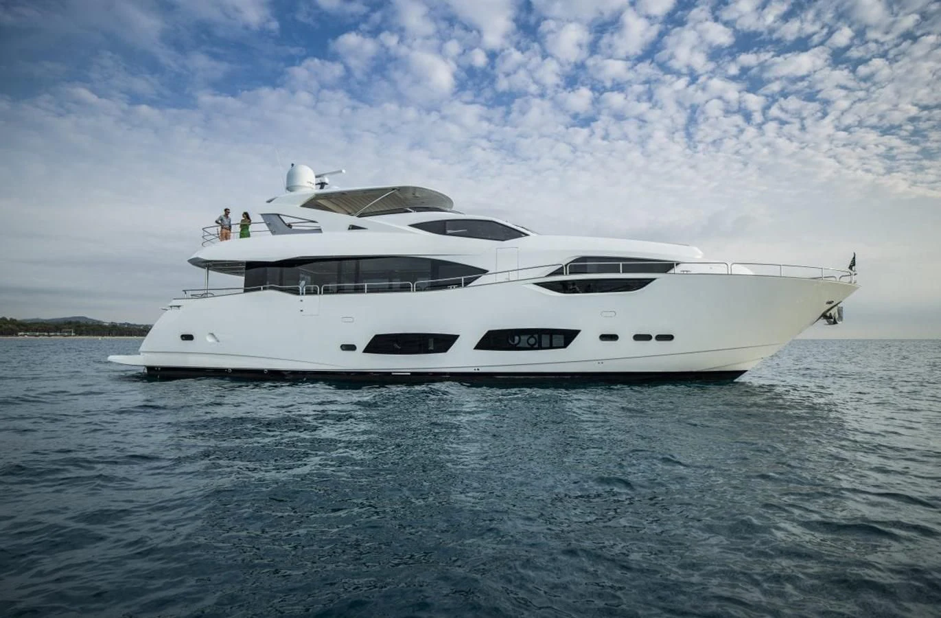 a white yacht on the water aboard SUNSEEKER 95 Yacht for Sale