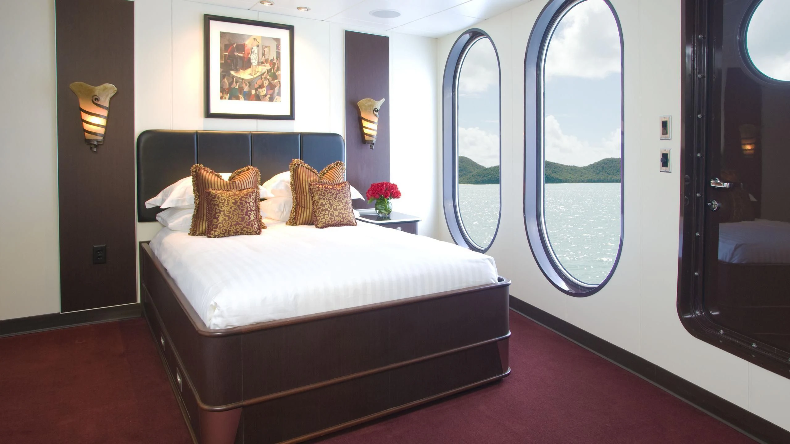 a bed in a room aboard GLOBAL Yacht for Sale