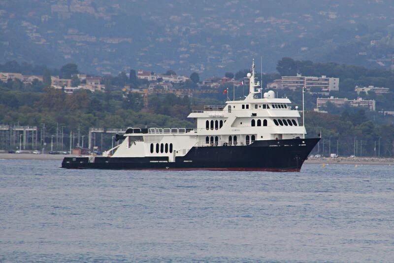 a large ship in the water aboard GLOBAL Yacht for Sale