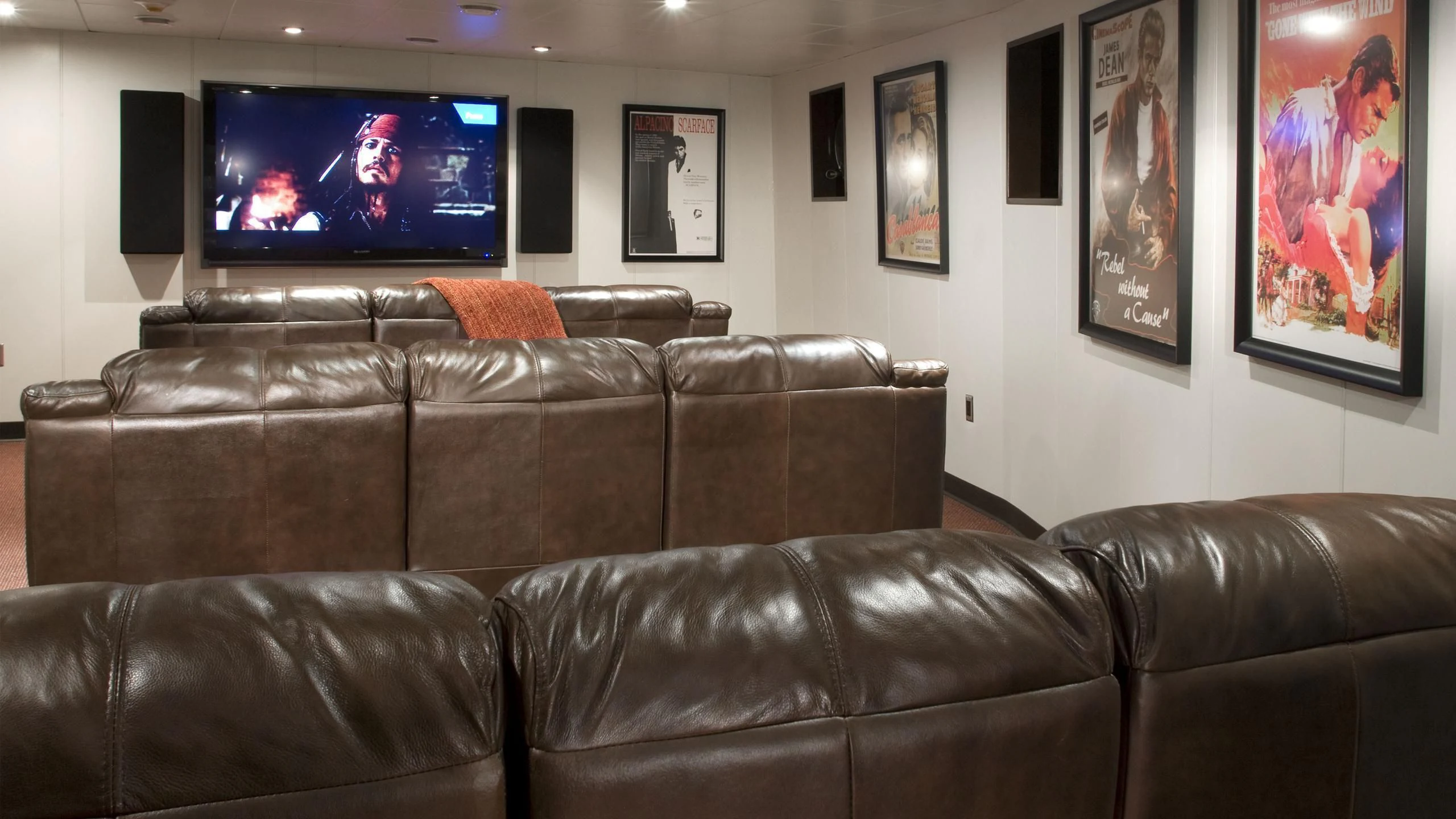 a leather couch in a room aboard GLOBAL Yacht for Sale