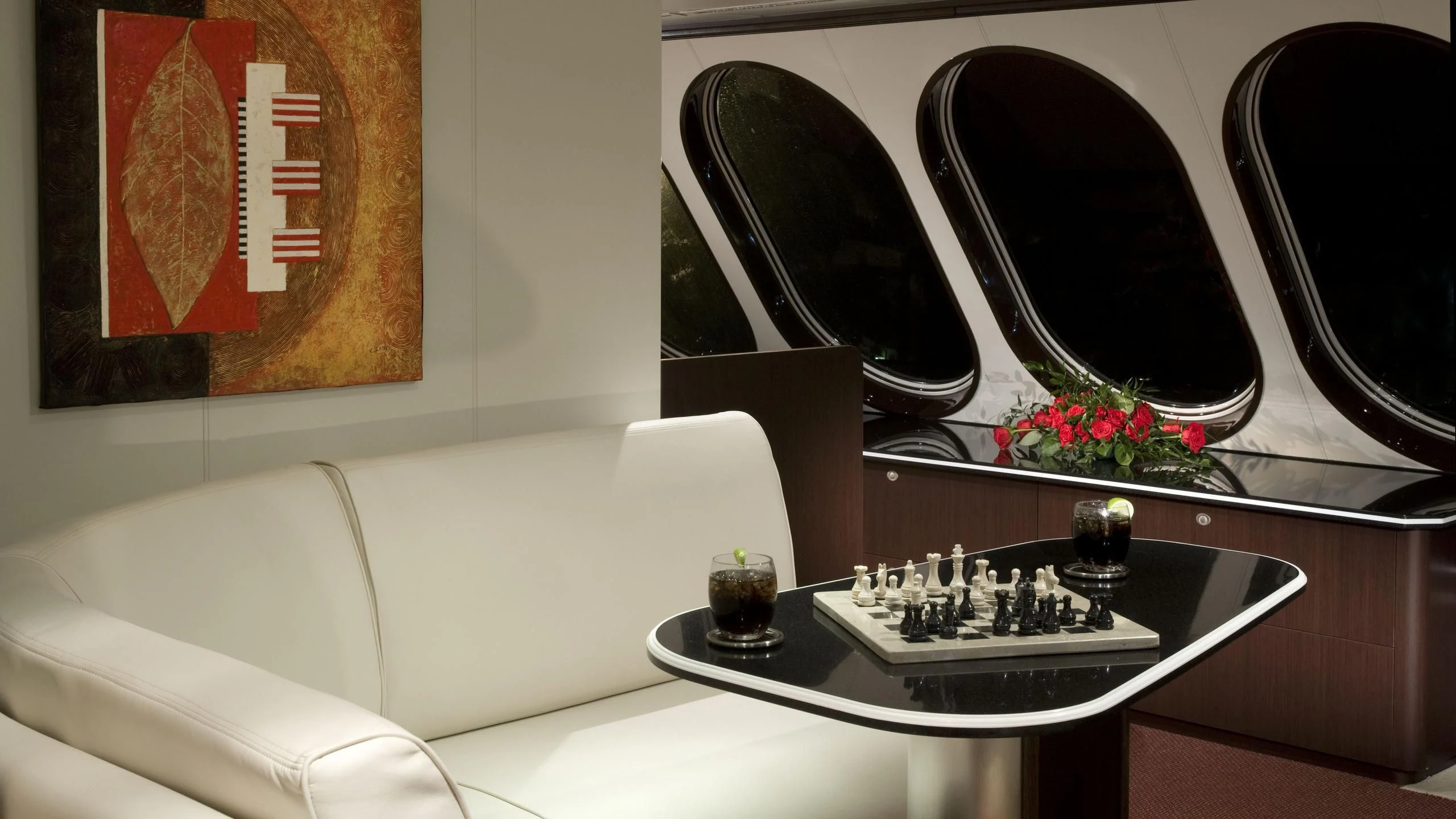 a table with a tray of chess and a mirror aboard GLOBAL Yacht for Sale