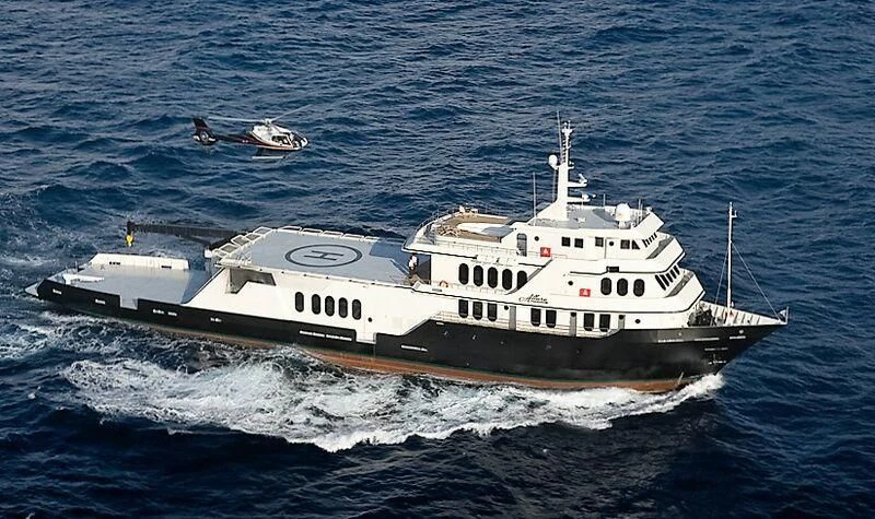 a large ship in the water aboard GLOBAL Yacht for Sale