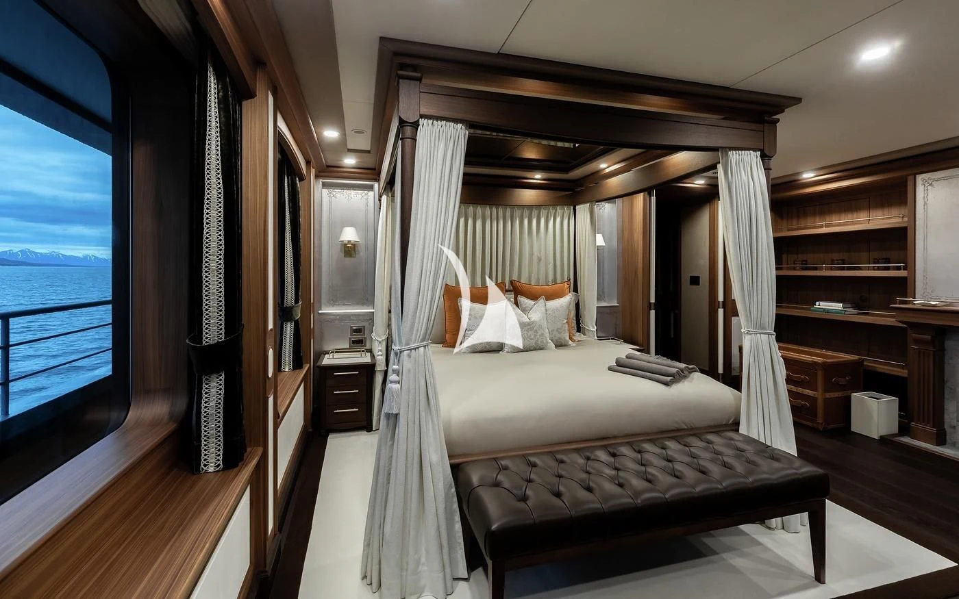a room with a bed and a window aboard Q Yacht for Sale
