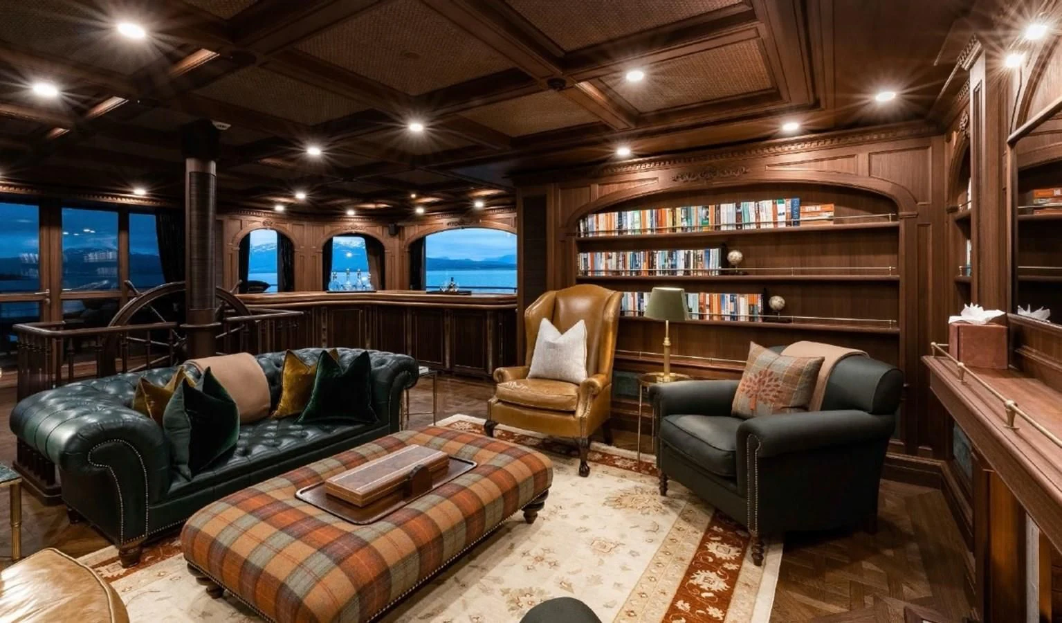 a living room with a couch and a tv aboard Q Yacht for Sale