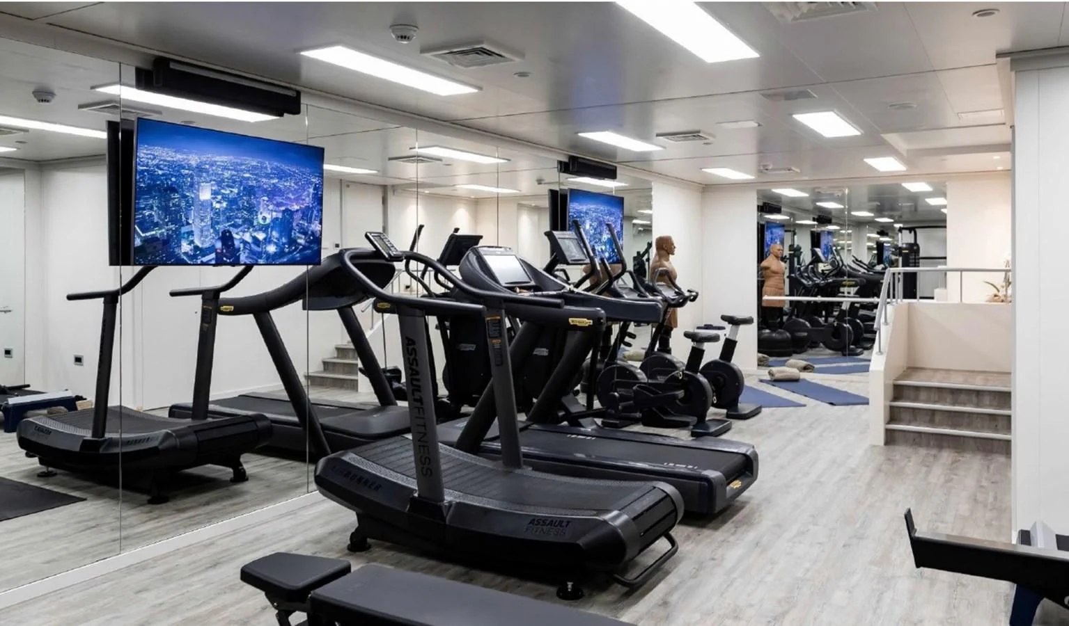 a person working out in a gym aboard Q Yacht for Sale