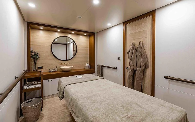 a bedroom with a large mirror aboard Q Yacht for Sale