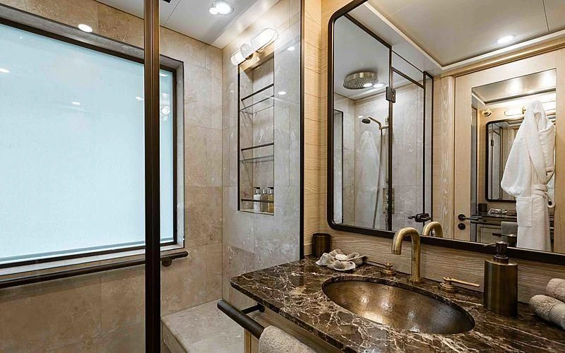 a bathroom with a marble countertop aboard Q Yacht for Sale