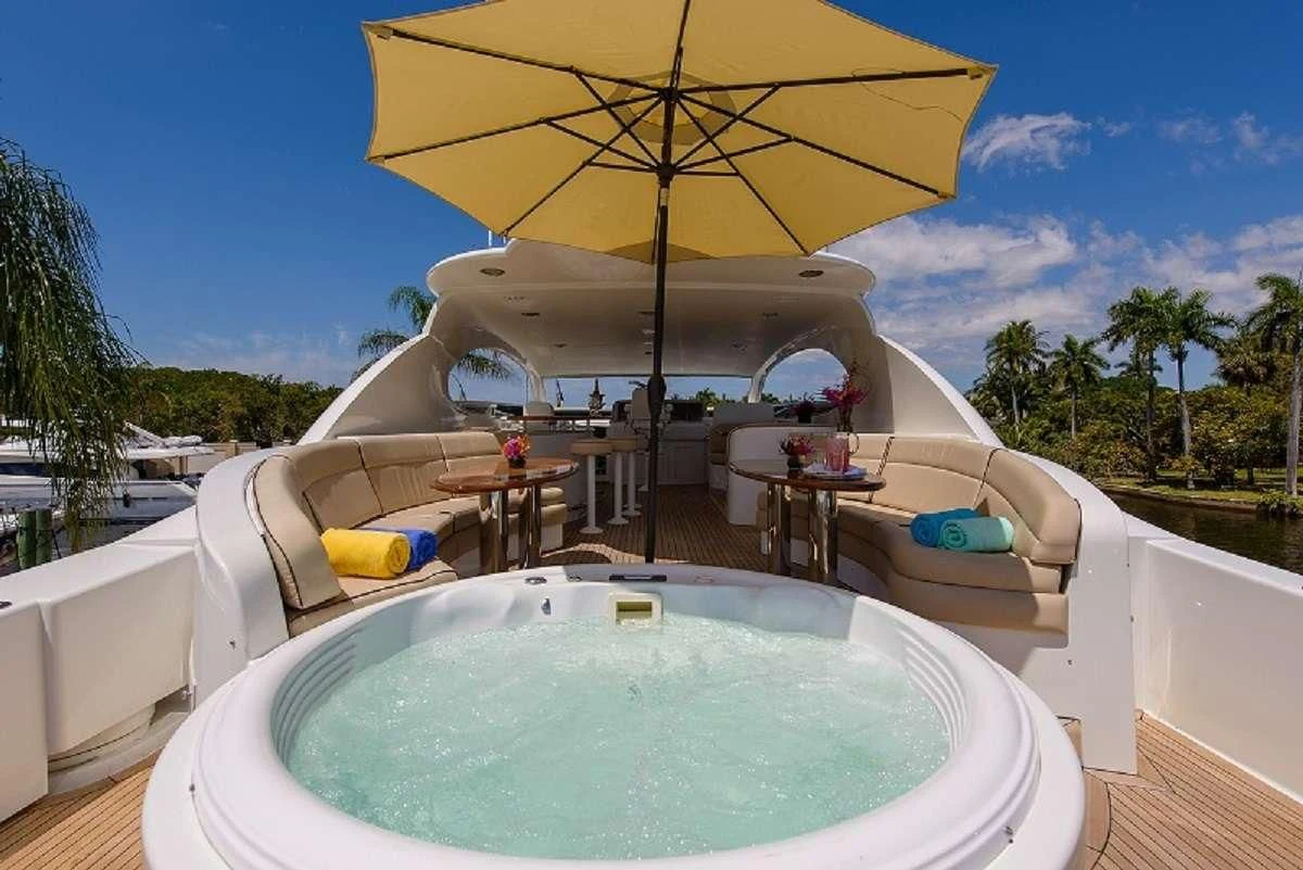 a pool with a yellow umbrella aboard LADY KRISTINA Yacht for Sale