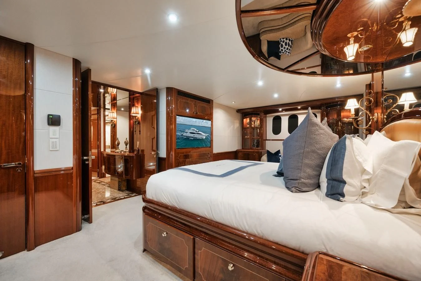 a bedroom with a large bed aboard LADY KRISTINA Yacht for Sale