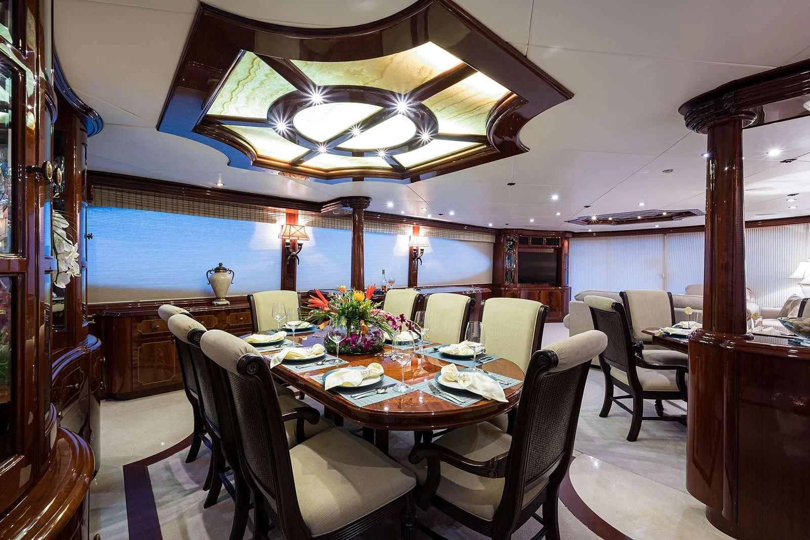 a dining room with a table and chairs aboard LADY KRISTINA Yacht for Sale