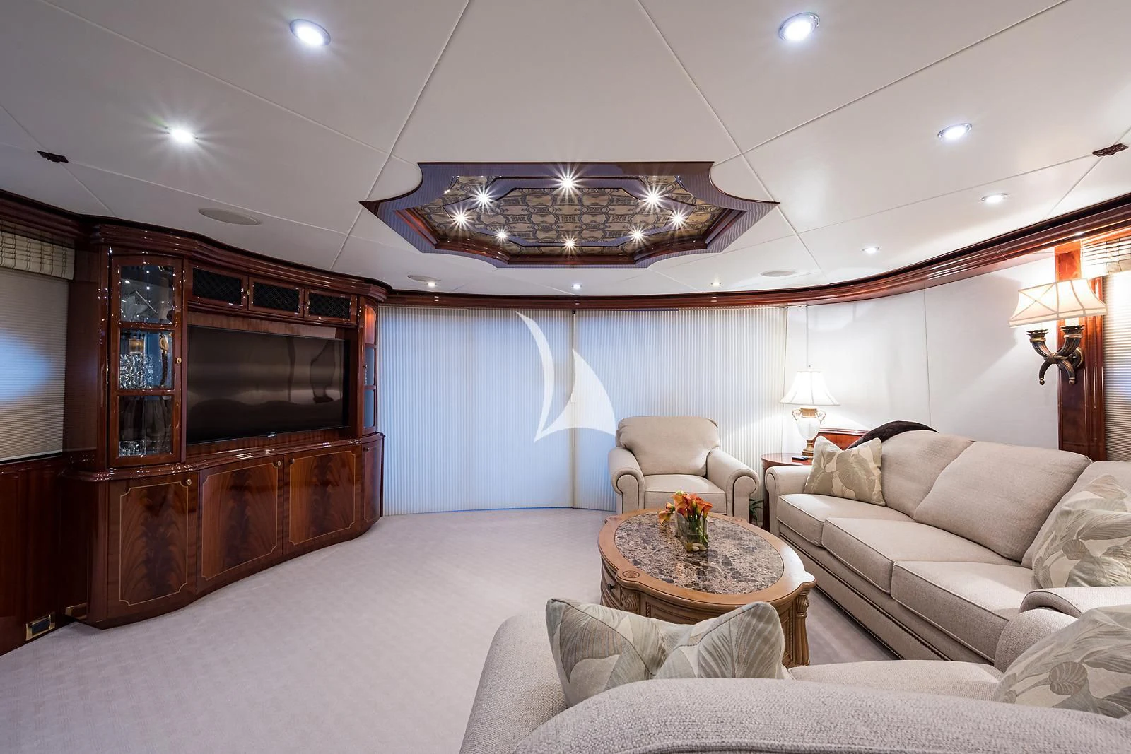 a living room with a fireplace aboard LADY KRISTINA Yacht for Sale