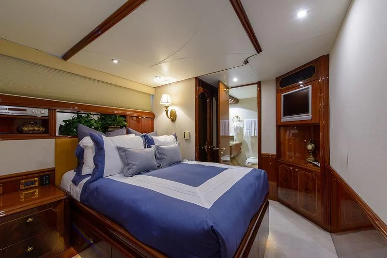 a bed in a room aboard LADY KRISTINA Yacht for Sale