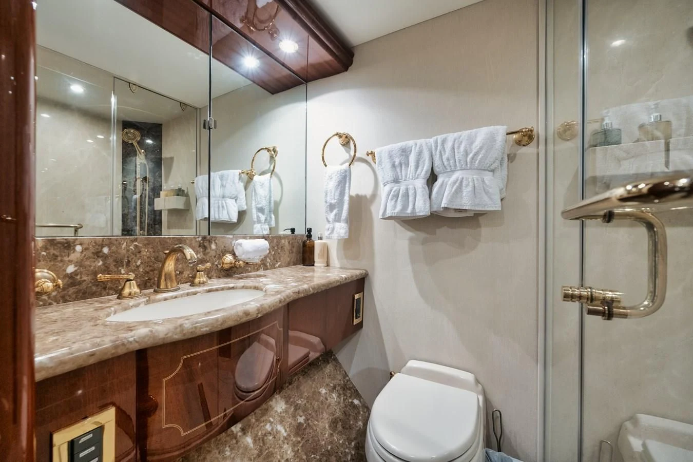 a bathroom with a large mirror aboard LADY KRISTINA Yacht for Sale