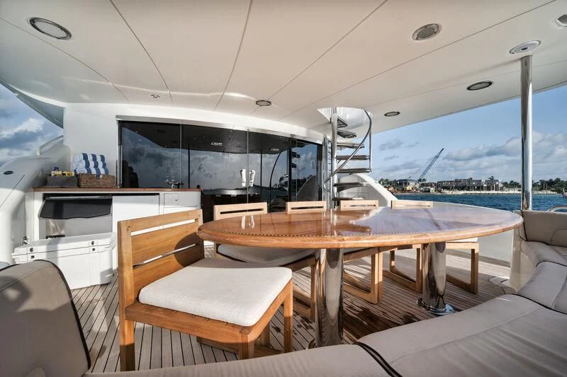 a room with a table and chairs aboard LADY KRISTINA Yacht for Sale