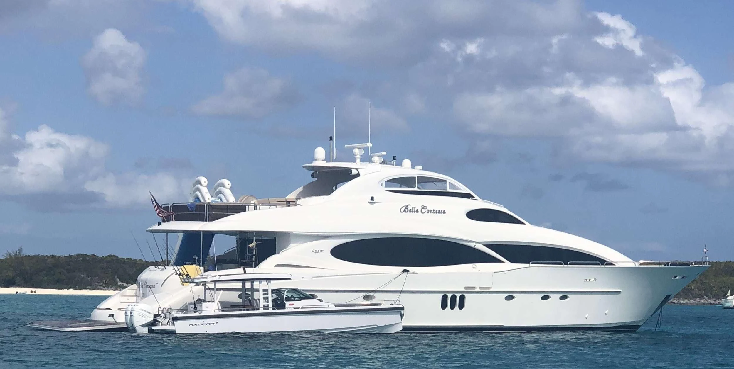 a white yacht in the water aboard LADY KRISTINA Yacht for Sale