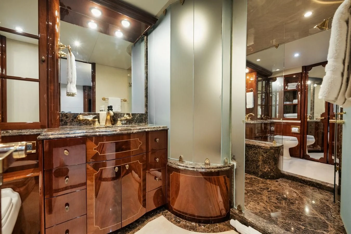 a bathroom with a large mirror aboard LADY KRISTINA Yacht for Sale