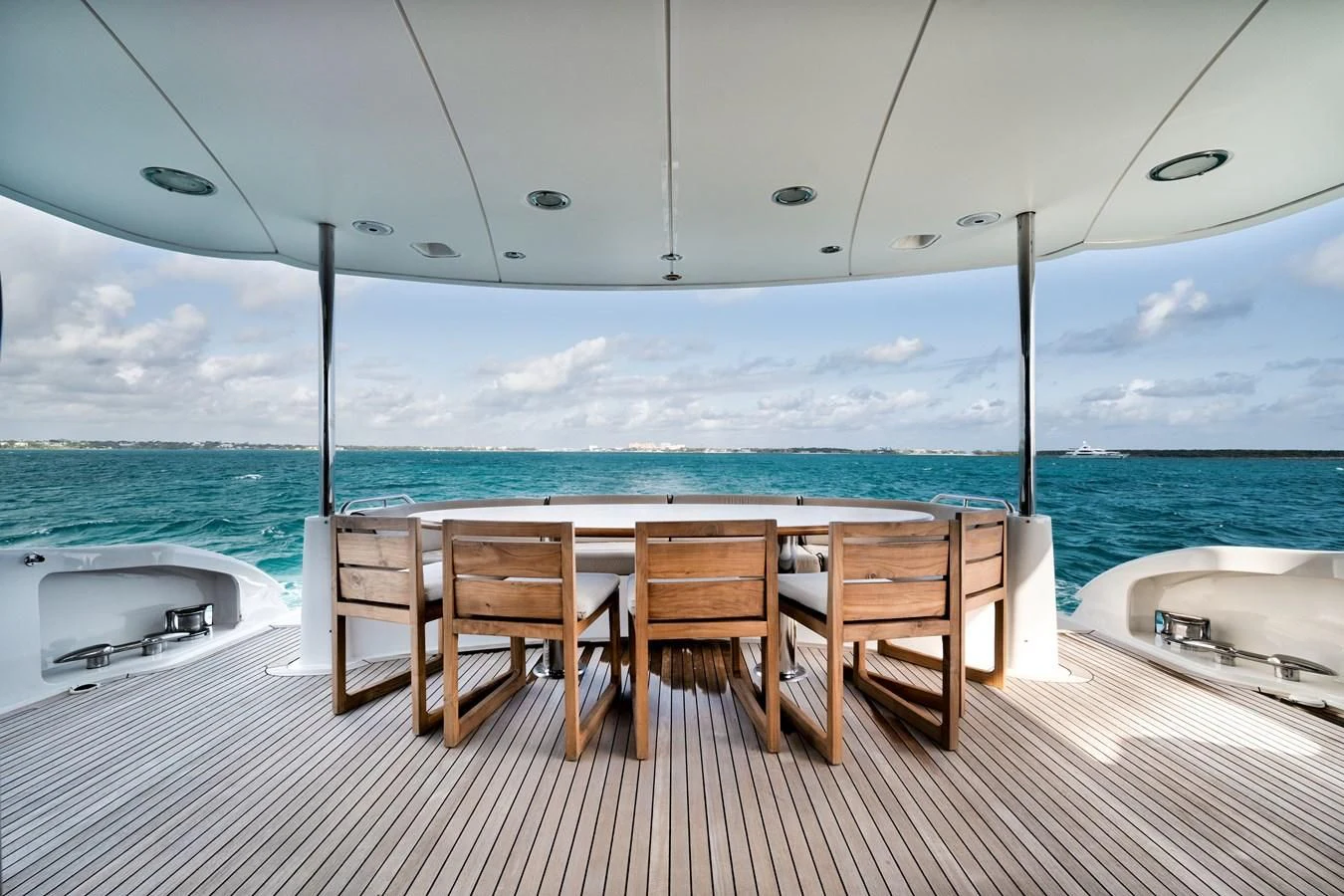 a table and chairs on a deck aboard LADY KRISTINA Yacht for Sale
