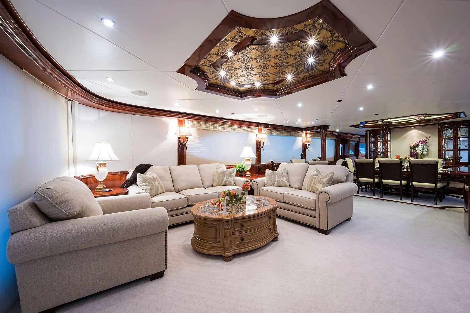 a living room with a large mirror aboard LADY KRISTINA Yacht for Sale
